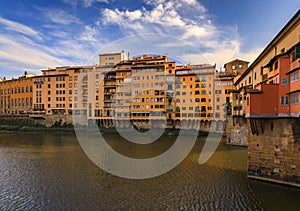 Famous Ponte Vecchio bridge with silversmith shops on Arno River, Florence Italy