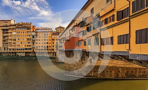 Famous Ponte Vecchio bridge with silversmith shops on Arno River, Florence Italy photo
