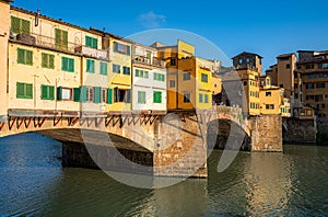 Famous Ponte Vecchio with river Arno at sunset in Florence, Italy