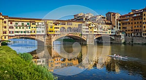 Famous Ponte Vecchio with river Arno at sunset in Florence, Italy