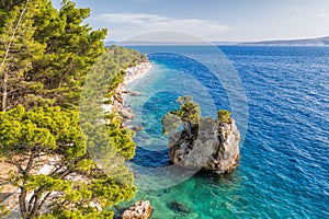 Punta Rata beach with little island in Brela, Dalmatia, Croatia photo