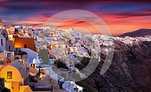 The famous, red summer sunsets over the Greek island of Santorini