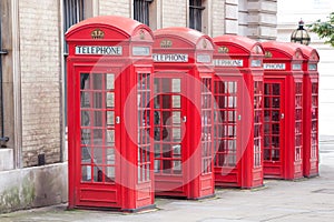 Famous red telephone booths in Covent Garden street, London, England photo