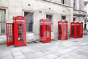 Famous red telephone booths in Covent Garden street  London  England photo