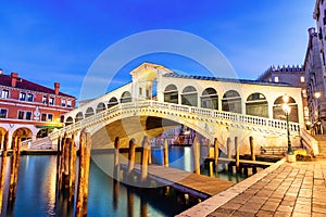 Famous Rialto Bridge of Venice on the Grand Canal at twilight, Italy