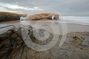 The famous rocky arch visible at low tide on As Catedrais beach