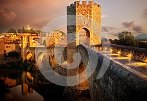 Famous Romanesque Bridge in BesalÃº, Catalonia, Spain during sunset