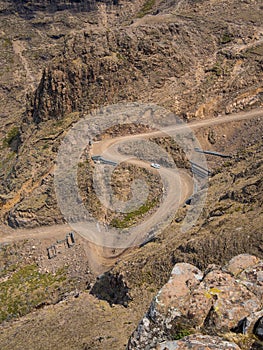 The famous Sani mountain pass dirt road with many tight curves connecting Lesotho and South Africa