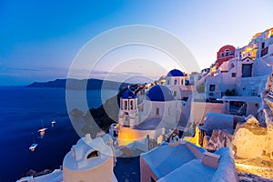 Famous Santorini blue dome churches at night, Oia, Santorini, Greece