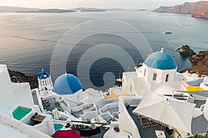 Famous Santorini blue domes and Aegean ocean