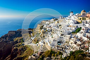Famous Santorini, Greece. Charming view of the village of Oia on the island of Santorini. Traditional famous windmills with and