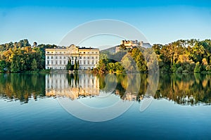 Famous Schloss Leopoldskron with Hohensalzburg Fortress in Salzburg at sunset, Austria photo