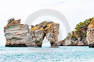 Famous sea stacks of Baia delle Zagare bay in Gargano National park. Natural rock sculptures made by Adriatic sea waves, wind and