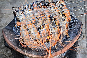 Famous seafood and People around the world well known : shrimp grilled bbq seafood on stove, Grilled River Prawns on the flaming.