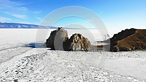 The famous Shamanka rock on the island of Olkhon. Lake Baikal on a sunny spring day.