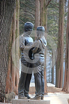Famous Statue of Bae Yong-Joon and Choi Ji-Woo from Korean Television Drama Series Winter Sonata on Nami Island, South Korea photo