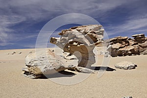 The famous stone tree rock formation & x28;Arbol de Piedra& x29; in the Siloli desert in the region of the Uyuni Salt Flat