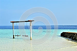 Famous swings In a biyadhoo island of Maldives photo