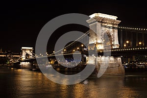 The famous szÃ©chenyi Chain bridge over the Danube river in the night illumination. Budapest,