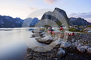 Famous tourist attraction Hamnoy fishing village on Lofoten Islands, Norway with red rorbu houses, in summer