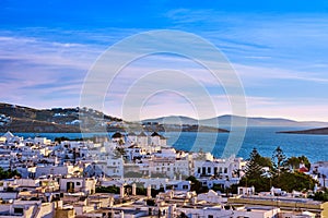 Famous tourist attraction of Mykonos, Greece. Beautiful sunset over traditional whitewashed windmills. Travel