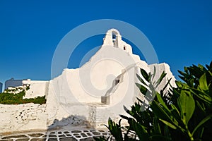Famous tourist landmark, Mykonos, Greece. White Greek Orthodox church of Panagia Paraportiani, town of Chora on island