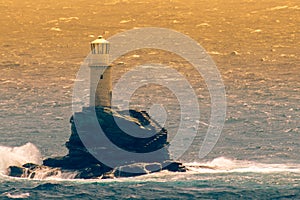 Famous Tourlitis lighthouse in Andros island in Greece.