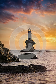 The famous Tourlitis lighthouse on a rock in the Aegean sea
