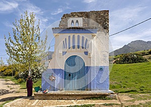 Famous traditional door on the road into Chefchaouen, a city in northwest Morocco noted for its buildings in shades of blue.