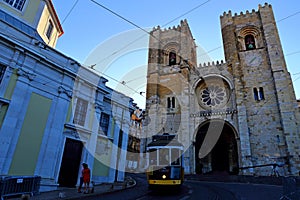 Famous tram line 28 passing in front of Cathedral of St. Mary Major Se de Lisboa in Lisbon,