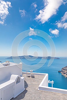 Famous travel destination, idyllic view of white architecture and blue sea under blue sky. Luxury travel and summer vacation