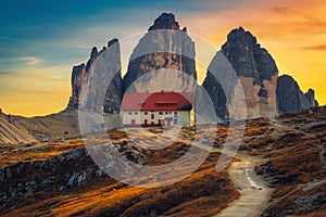 Famous Tre Cime di Lavaredo peaks at sunset, Dolomites, Italy photo