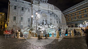 The famous Trevi Fountain at night timelapse hyperlapse. photo