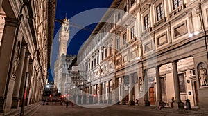 The famous Uffizi and the tower of the Palazzo Vecchio of Florence illuminated at night