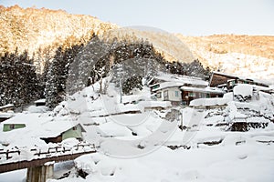 A famous valley hot spring covered in snow at Yamanouchi in Nagano.