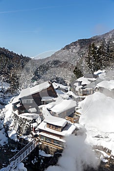 A famous valley hot spring covered in snow at Yamanouchi in Nagano.