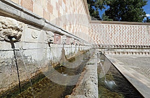 Famous very fountain called Delle 99 Cannelle in Laquila city in photo
