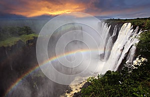 Victoria Falls sunset with rainbow, Zambia photo