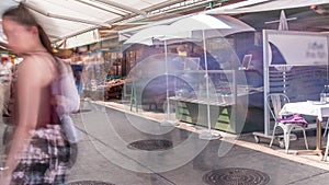 Famous Viennese Naschmarkt food market timelapse with customers stralling between the vegetable and fish stalls in