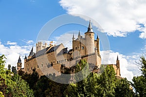 The famous view of the Alcazar of Segovia in a sunny summer day from the view point of la Pradera de San Marcos, Segovia photo