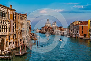 Famous view of Basilica di Santa Maria della Salute and grand canal from Accademia Bridge, Venice, Italy photo