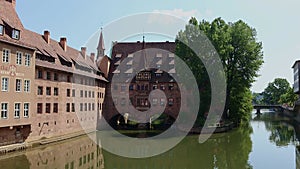 Famous view of Glasses of Nuremberg Heilig-Geist-Spital in old city Nuremberg in Franconia, Bavaria, Germany. Historical
