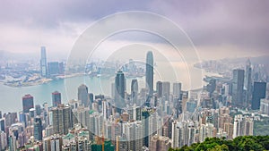 The famous view of Hong Kong from Victoria Peak night to day timelapse. Taken before sunrise with colorful clouds over