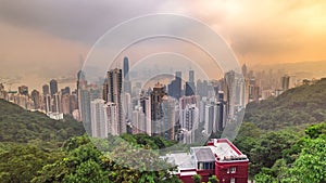 The famous view of Hong Kong from Victoria Peak timelapse. Taken at sunrise while the sun climbs over Kowloon Bay.