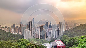 The famous view of Hong Kong from Victoria Peak timelapse. Taken at sunrise while the sun climbs over Kowloon Bay.