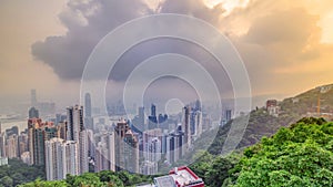 The famous view of Hong Kong from Victoria Peak timelapse. Taken at sunrise while the sun climbs over Kowloon Bay.