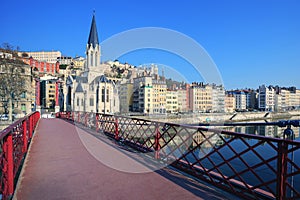 Famous view of Saone river and red footbridge in Lyon city