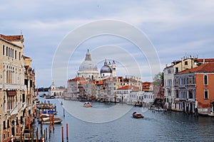 Famous view of Venice Grand Canal with Saint Mary of Health dome on sunny day.