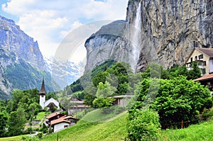 Famous village of great waterfall Lauterbrunnen in swiss alps