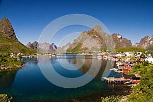 Famous village Reine with Rorbu huts in sunny weather, Lofoten islands, Norway